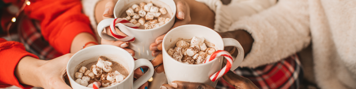 Themed hot cocoa mugs to use as a party favor when you're hosting in your home for the holiday